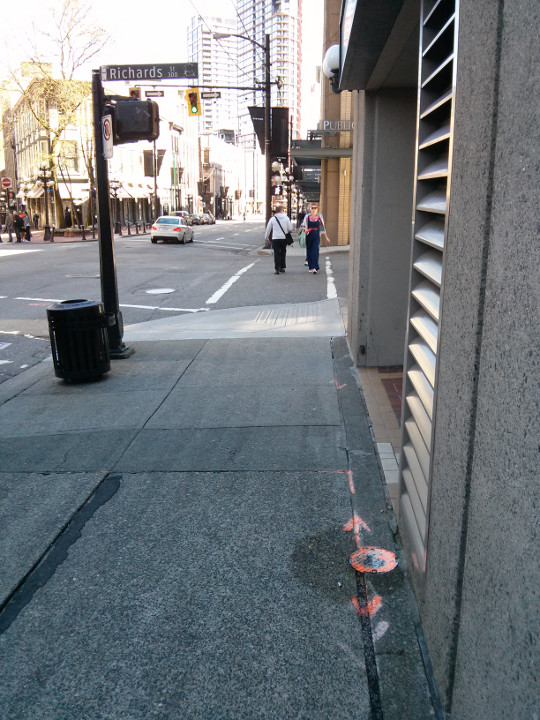 Surface Inlaid FIber, fiber in slot in sidewalk with junction canister at building entrance